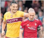  ??  ?? Dons’ Scott Brown (right)