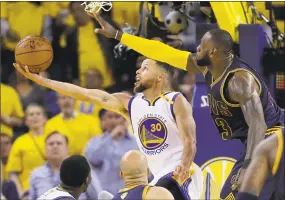  ?? Marcio Jose Sanchez / Associated Press ?? In this June 1, 2017, file photo, the Warriors’ Stephen Curry drives against the Cavaliers’ LeBron James during Game 1 of the NBA Finals in Oakland.