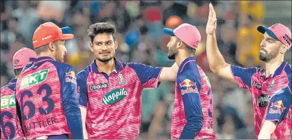  ?? BCCI ?? RR’s Kuldeep Sen (3rd from left) returned figures of 4/20 in 3.3 overs to help his team beat RCB by 29 runs at the MCA Stadium in Pune on Tuesday.