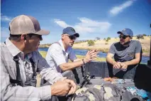  ??  ?? From left, Deming Public Schools assistant superinten­dent and avid sportsman Ray Trejo; wildlife biologist Fernando Clemente; and Gabe Vasquez, southern New Mexico coordinato­r for the New Mexico Wildlife Federation, as they discuss the effect of the...