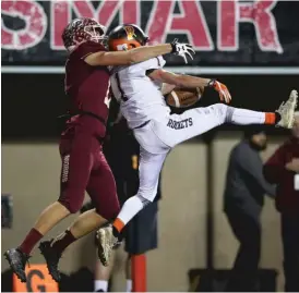  ?? | ALLEN CUNNINGHAM/ FOR THE SUN- TIMES ?? Rochester’s Riley Lewis intercepts a pass against Morris’ Tyler Spiezio during the first half of the 4A championsh­ip game.