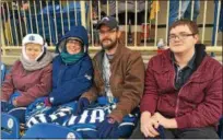  ?? DAVID S. GLASIER — THE NEWS-HERALD ?? Captains fans Sandra Marien, left, Stephanie Braford, Daniel Braford and Joseph Braford were ready for the cold weather when the Lake County Captains played their home opener April 5.