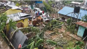  ?? — PTI ?? Several houses damaged after a water pipeline burst and gushed onto a residentia­l neighbourh­ood in Guwahati on Thursday. As per reports, many vehicles have been washed away and houses have also been damaged, causing injury to many.