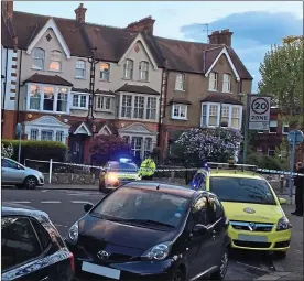  ??  ?? Crime scene: forensic police investigat­ors looking for clues in Wandsworth. Above left, shocked local residents Imogen Thomas and Ainsley Harriott