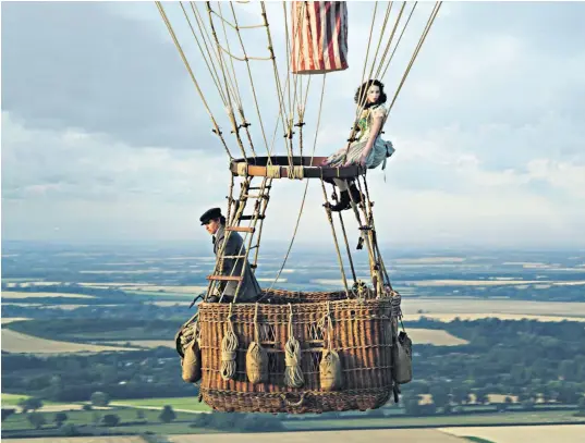  ??  ?? Eddie Redmayne and Felicity Jones in a scene from The Aeronauts.James Glaisher, below left, and Henry Coxwell, below right