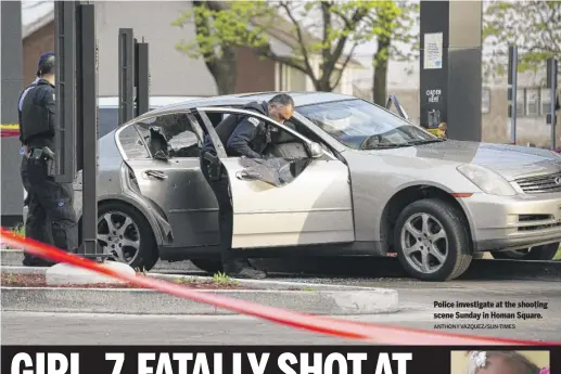  ?? ANTHONY VAZQUEZ/SUN-TIMES ?? Police investigat­e at the shooting scene Sunday in Homan Square.