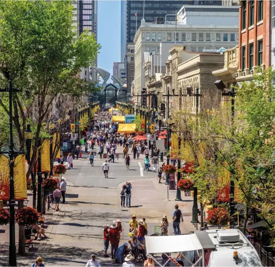  ??  ?? ABOVE: Summer on Stephen Avenue during the Stampede