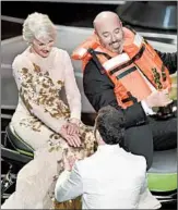  ?? CHRIS PIZZELLO/INVISION ?? Jimmy Kimmel, bottom, greets Helen Mirren and Jet Ski winner Mark Bridges during the Oscars on Sunday.