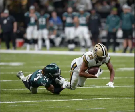  ?? BILL FEIG — THE ASSOCIATED PRESS ?? Cornerback Cre’von LeBlanc, tripping up Saints wide receiver Tre’Quan Smith last week, will get a bigger role in the defense this week as injuries continue to pile up in the Eagles secondary.