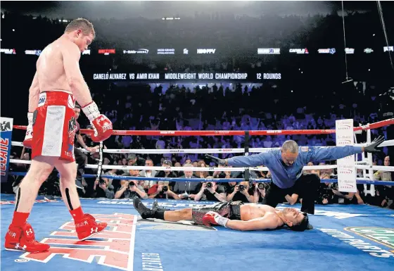  ??  ?? Canelo Alvarez knocks out Amir Khan in Las Vegas last year.