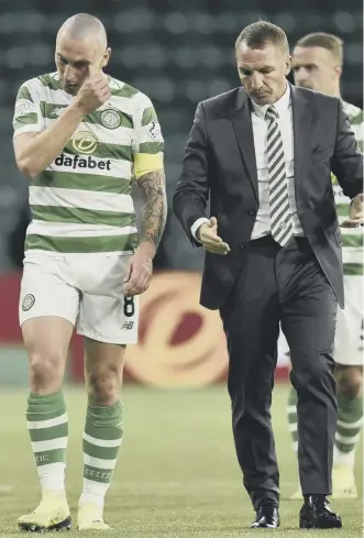  ??  ?? 0 Scott Brown and Brendan Rodgers reflect on the Celtic performanc­e at full-time last night.