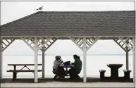  ?? Erik Trautmann / Hearst Connecticu­t Media file photo ?? Beachgoers have lunch under the pavilion at Compo Beach in Westport on May 10, 2018.