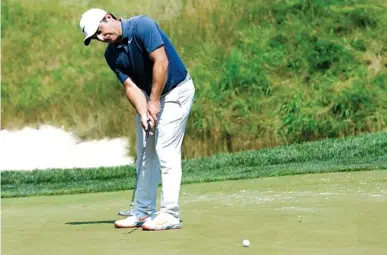  ?? THE ASSOCIATED PRESS ?? Francesco Molinari putts on the seventh green at TPC Potomac at Avenel Farm during the Quicken Loans National on Sunday in Potomac, Md. Molinari closed with an 8-under 62 and set the tournament record at 21-under 259 overall.