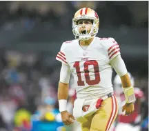  ?? AP-Yonhap ?? San Francisco 49ers quarterbac­k Jimmy Garoppolo reacts after tight end George Kittle scored a touchdown during the second half of an NFL football game against the Arizona Cardinals in Mexico City, Monday.