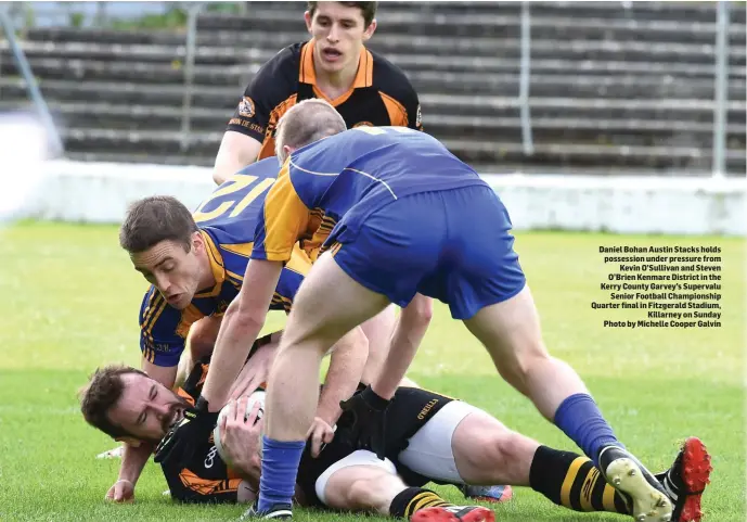  ?? Photo by Michelle Cooper Galvin ?? Daniel Bohan Austin Stacks holds possession under pressure from Kevin O’Sullivan and Steven O’Brien Kenmare District in the Kerry County Garvey’s Supervalu Senior Football Championsh­ip Quarter final in Fitzgerald Stadium, Killarney on Sunday