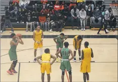  ?? STAFF PHOTO BY TED BLACK ?? St. Charles High School senior Amir Dade prepares to attempt a free throw in Monday’s 73-62 setback at North Point. St. Charles led on only three different occasions in the third quarter, but North Point opened the fourth quarter on a 12-0 run to break open a tight game with the Spartans en route to a comfortabl­e victory in the season opener for both SMAC boys basketball teams.