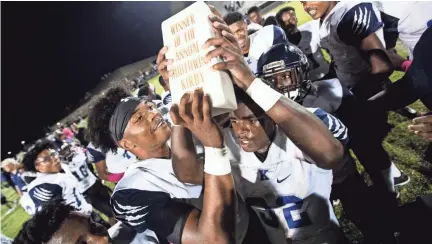  ?? ARIEL COBBERT, THE COMMERICAL APPEAL ?? Kirby High School Cougars celebrate their 33-14 victory over the Southwind Jaguars Friday October 5, 2018. The Cougars