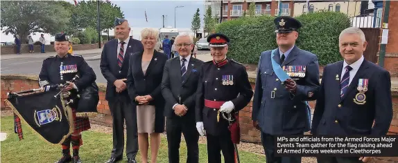  ?? ?? MPs and officials from the Armed Forces Major Events Team gather for the flag raising ahead of Armed Forces weekend in Cleethorpe­s