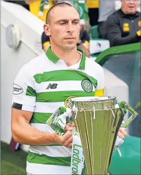  ??  ?? Celtic skipper Scott Brown with the SPFL trophy