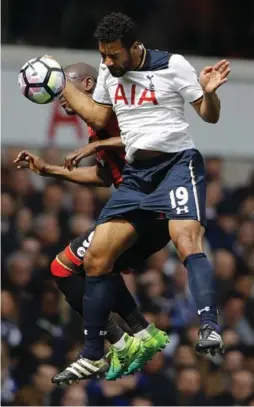  ?? FRANK AUGSTEIN/THE ASSOCIATED PRESS ?? Tottenham Hotspur’s Mousa Dembele, front, and Bournemout­h’s Benik Afobe challenge for the ball during Premier League action on Saturday in London.