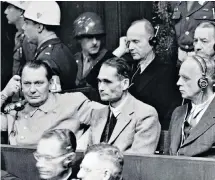  ??  ?? Rudolf von Ribbentrop in 1943 and, far right, his father on trial at Nuremberg with Hermann Goering and Rudolf Hess