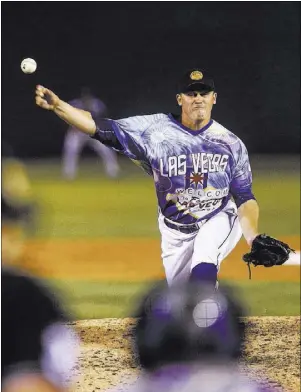  ??  ?? 51s relief pitcher Paul Sewald delivers against El Paso on May 13 at Cashman Field. The 26-year-old Bishop Gorman product is one step from reaching the majors with the New York Mets, but that proximity is not reflected in his salary, which he figures...