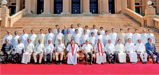  ??  ?? President Gotabaya Rajapaksa and Prime Minister Mahinda Rajapaksa are seen with the new State Ministers after they were sworn in on Wednesday. Former President and SLFP leader Maithripal­a Sirisena whose party had linked with the ruling Sri Lanka Podujana Peramuna, says he was not even consulted on the appointmen­t of SLFP State Ministers