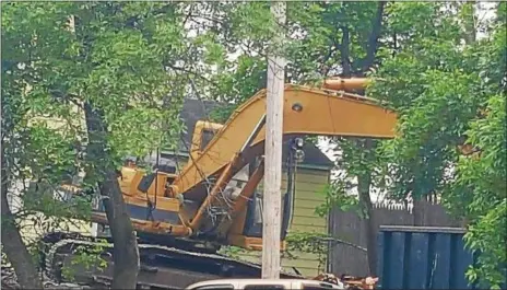  ?? PHOTO COURTESY SHAWN MORSE ?? A crew demolishes a blighted home on Saratoga Street in Cohoes last week.