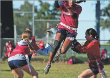  ?? AP ?? Sonya Chalil jumps between Kirby White (left) and Bella Franks during a Texas Fury practice session in Austin, Texas, last year.