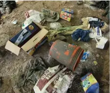  ?? AP ?? WHAT A MESS: Garbage left at a cannabis grow site litters the ground in the Shasta-Trinity National Forest in California, including fertilizer and poison.