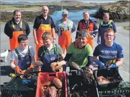  ??  ?? Alistair Dutton met Barra fishermen, left to right, Colin MacNeil, Angus Campbell, Angus John MacNeil, Hector MacLean and Donnie McLean and, front, teenage helpers Andrew MacNeil, 13, James MacNeil and Cailean MacNeil, 14.