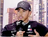  ??  ?? Lewis Hamilton of Mercedes attends a press conference at the Albert Park circuit ahead of the Australian Grand Prix in Melbourne on Thursday.