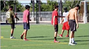  ?? RECORDER PHOTO BY NAYIRAH DOSU ?? Groups of no more than 10 Lindsay High School football players go through workouts, Wednesday, July 1, in Lindsay.