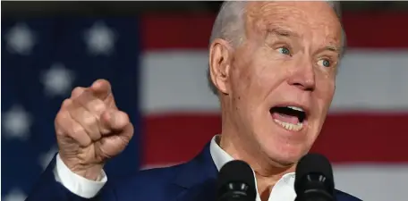  ?? GETTY IMAGES ?? NOT ALL THERE?: Democratic presidenti­al candidate Joe Biden speaks during a rally at Tougaloo College in Tougaloo, Miss., on Sunday. As his support surges, detractors have stared to point to his questionab­le record, behavior and too many senior moments.