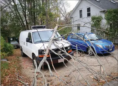  ??  ?? Above, trees and wires were still down at this home at 366 New River Road in the Manville section of Lincoln Wednesday morning. There were no signs of National Grid and power was still out in some sections of Lincoln as well as the rest of Rhode...