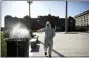  ?? NATACHA PISARENKO - THE AP ?? A man sprays bleach at Plaza de Mayo in Buenos Aires, Argentina, Friday, March 20. Argentina’s government imposed a countrywid­e lockdown to contain the spread of the coronaviru­s.