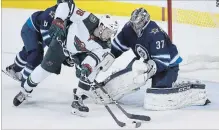  ?? CANADIAN PRESS FILE PHOTO ?? Minnesota Wild’s Jordan Greenway can’t get the puck past Winnipeg Jets goaltender Connor Hellebuyck during the first period of Game 5 in Winnipeg on April 20.