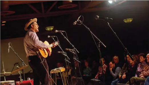  ?? KIM RAFF / THE NEW YORK TIMES ?? Dom Flemons, founding member of the Carolina Chocolate Drops, performs at the G Three Theater in Elko.