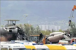  ?? AP ?? Ambulances parked near the wreckage of Algerian plane after it crashed in Boufarik on Wednesday