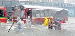  ??  ?? People wade through a waterlogge­d street at Byculla on Wednesday. South Mumbai received 293.8mm rain in 12 hours, the highest ever in August even for a 24-hour period since 1974.