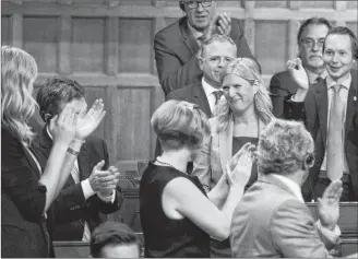  ?? CP PHOTO ?? Ontario MP Leona Alleslev is applauded as she stands to ask a question during question period in the House of Commons on Parliament Hill in Ottawa on Monday.