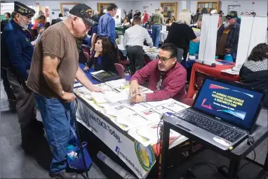  ?? RECORDER PHOTO BY CHIEKO HARA ?? The 7th annual Veterans Stand Down and Resource Fair featured 54 informatio­n and resource booths for veterans Thursday, Oct. 25 at the Veterans Memorial Building in Portervill­e.