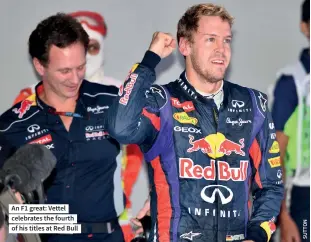 ?? ?? An F1 great: Vettel celebrates the fourth of his titles at Red Bull