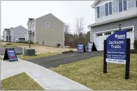  ?? KEITH SRAKOCIC — THE ASSOCIATED PRESS ?? Historical­ly low mortgage rates are helping nudge buyers into the market, but there is still a lack of inventory, which is pushing prices up.