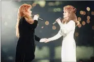  ?? ERIC DRAPER, FILE - THE ASSOCIATED PRESS ?? Wynonna Judd, left, and her mother, Naomi Judd, of The Judds, perform during the halftime show at Super Bowl XXVIII in Atlanta in 1994.