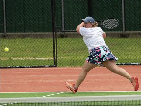  ?? Photo: Bev Lacey ?? I’VE GOT THIS: Lucy Easton stretches for a backhand return during her victory for Toowoomba in Sunday’s Duncan Thompson Cup clash with Ipswich at James St tennis centre.