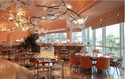  ?? Flamingo Collection ?? Flamingo Room in Abu Dhabi features Victorian-style wallpapers, coral hues and zebra patterns
