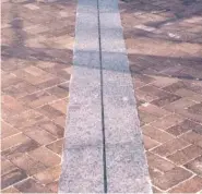  ??  ?? The path of the bullet that killed Dr. Martin Luther King Jr. is traced with dark bricks at the National Civil Rights Museum.
