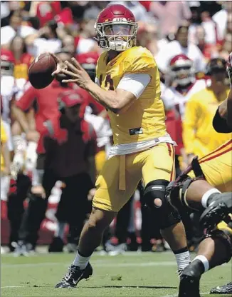  ?? Gary Coronado Los Angeles Times ?? CALEB WILLIAMS throws a pass during USC’s spring game at the Coliseum. Williams, an Oklahoma transfer, completed his first nine passes and finished 10 for 12 for 98 yards in the scrimmage.