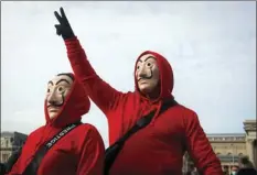  ?? LASZLO BALOGH
AP PHOTO/ ?? People wearing masks take part in a hospitalit­y sector workers protest, in Budapest, Hungary, Sunday. Protesters gathered at a central square in Hungary’s capital of Budapest on Sunday demanding a rethinking of the country’s lockdown restrictio­ns.